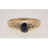 A 9 carat gold sapphire and diamond ring size L to M, 2g