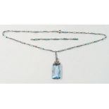 A French Art Deco Platinon 'aquamarine' and crystal glass pendant necklace (extra chain), stone