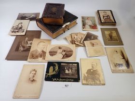 Two Victorian leather bound family photograph albums (both empty) together with a collection of 37