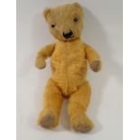 An early 20th century small gold mohair teddy bear, 34cm