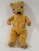 An early 20th century small gold mohair teddy bear, 34cm