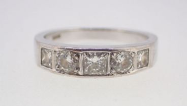A modern 18 carat white gold diamond ring set five brilliant and cushion cut stones, size M, 5.2g
