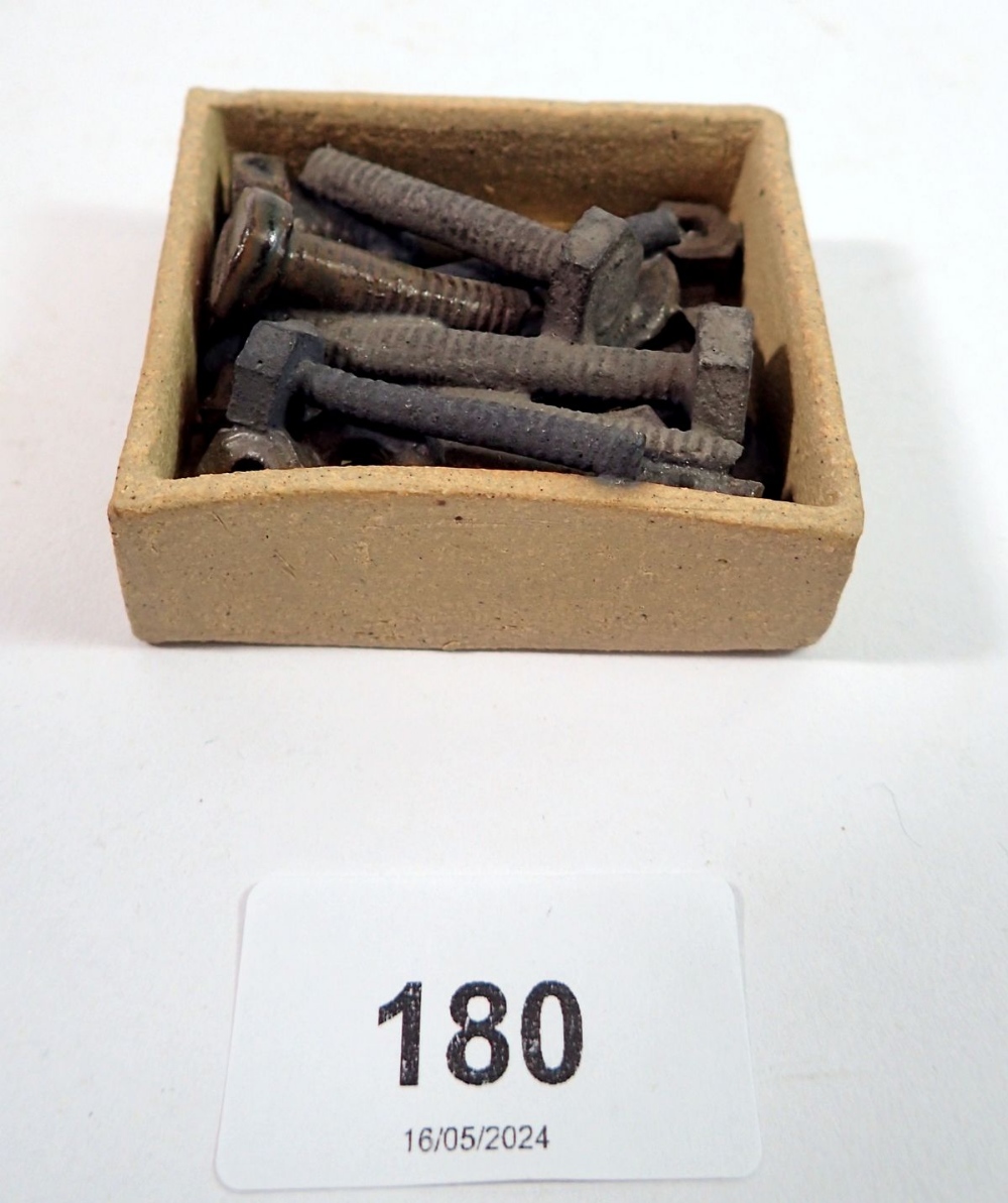 A Janet Halligan trompe l'oeil stoneware group of nuts and bolts, 6 x 5.5cm