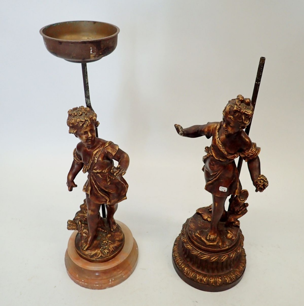 Two bronze finish lamp base figures of a boy and girl, (lacking lamp fittings) 44cm and 48cm tall