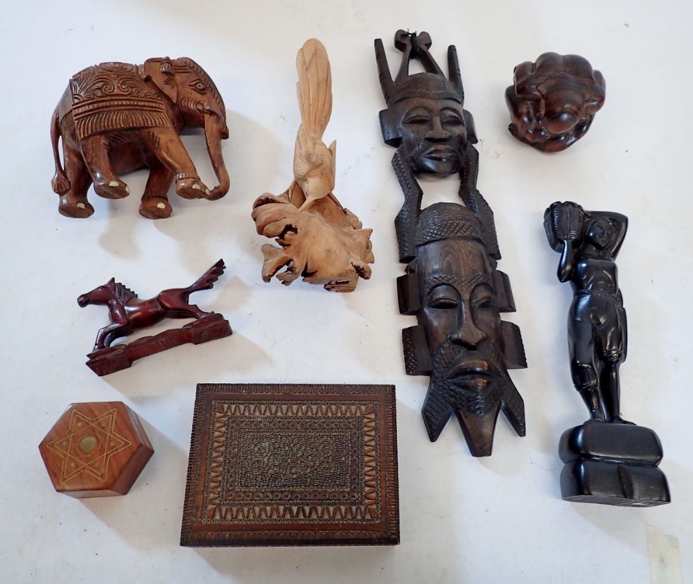 A collection of woodenware including ethnic hardwood figures, Buddha, card bird, box etc.