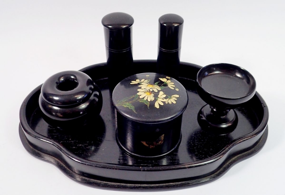 An ebony dressing table set and a papier mache box