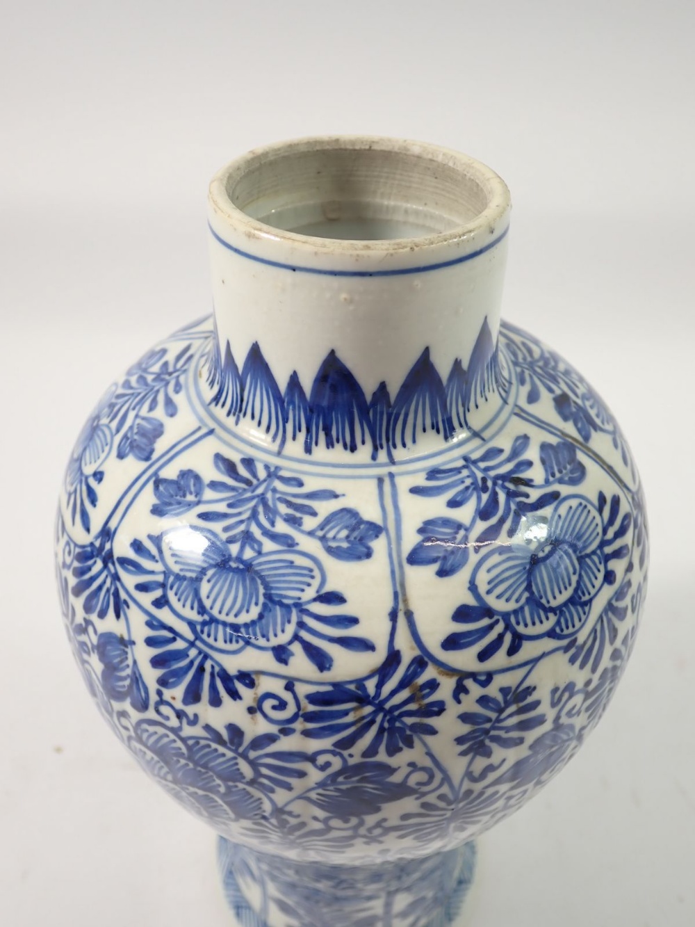 A Chinese 18th century blue and white baluster vase and cover with all over floral decoration, 28cm - Image 4 of 7