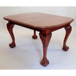 A Victorian mahogany windout dining table and two interleaves all on cabriole, claw and ball