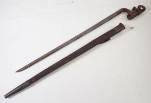 A 19th century socket bayonet and scabbard