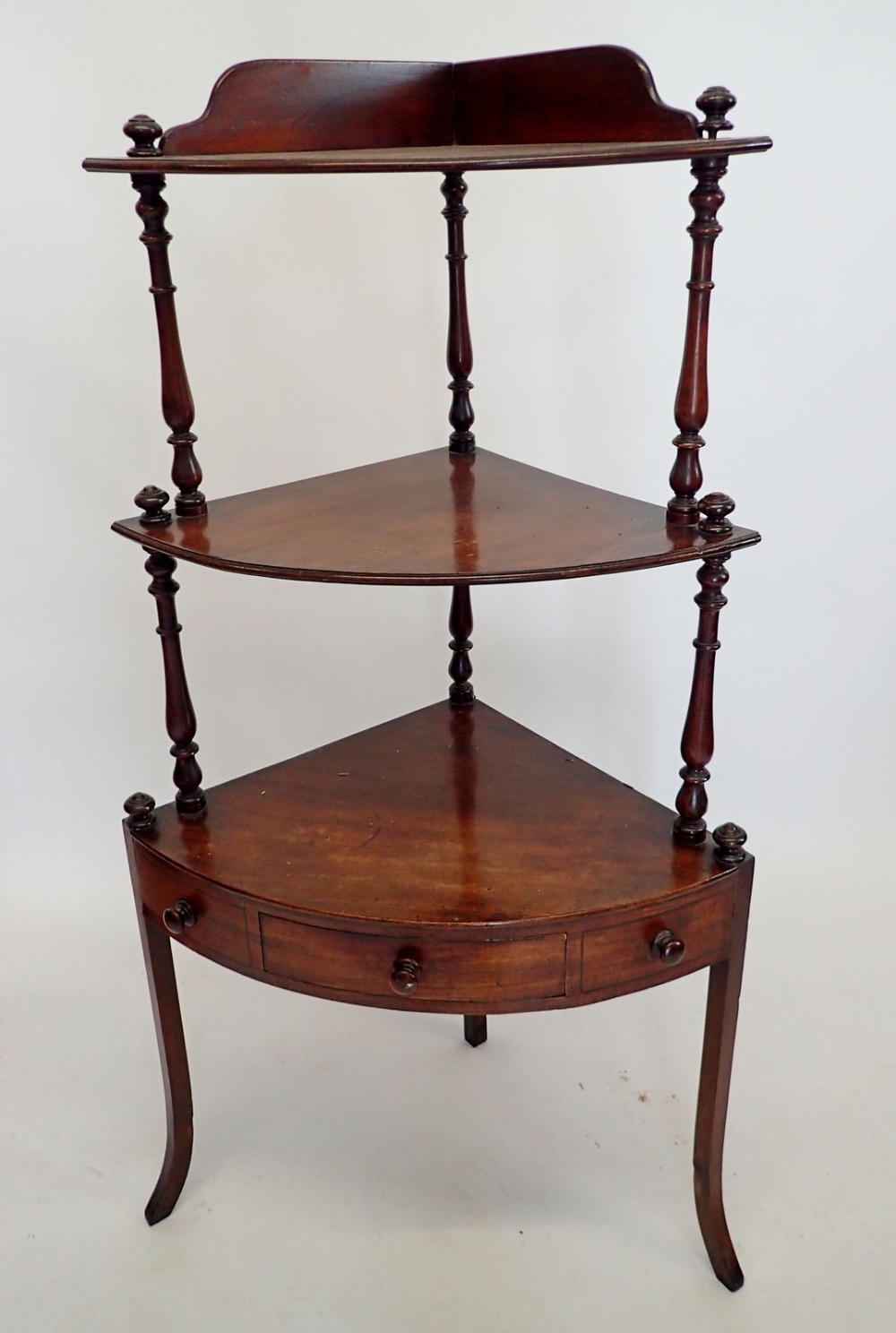 A 19th century mahogany corner whatnot with turned supports and drawer to apron, 126cm tall