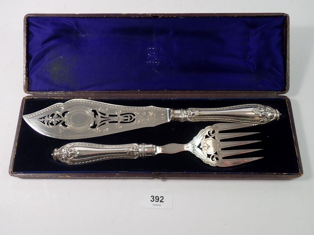 A Victorian silver plated set of fish servers, boxed with pierced and engraved decoration