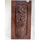 A carved oak openwork panel with roses and thistles, 58.5 x 30.5cm