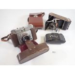 A Kodak Bantum camera, a Coronet bellows camera and an Ilford Sportsman camera