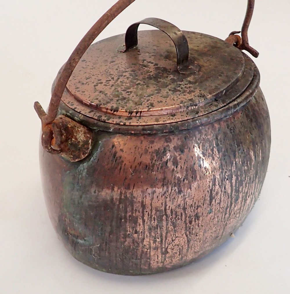 A Victorian large oval cooking pot with lid and hinged iron handle, 47cm wide - Image 2 of 2