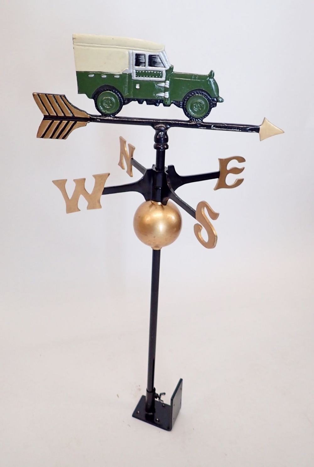 A weather vane featuring a Land Rover