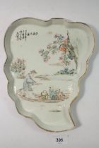 An 18th century Chinese leaf form platter with riverboat scene and inscription, 26.5cm long