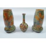 A pair of Royal Doulton Foliage Ware vases 19cm tall and one other