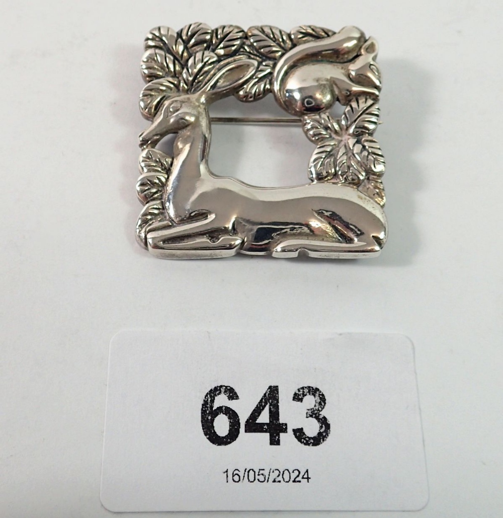 A Danish Sterling silver brooch in Georg Jensen style with deer and squirrel amongst foliage, 3.5