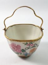 A late 18th century Japanese Kakiemon bowl with European gilded metal mounts and handle, 8.5cm wide