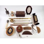 A box of collectables including tape measure, treen combs, carved box etc.