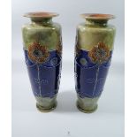 A pair of tall Doulton Stoneware vases with stylised floral decoration, signed indistinctly, 37cm