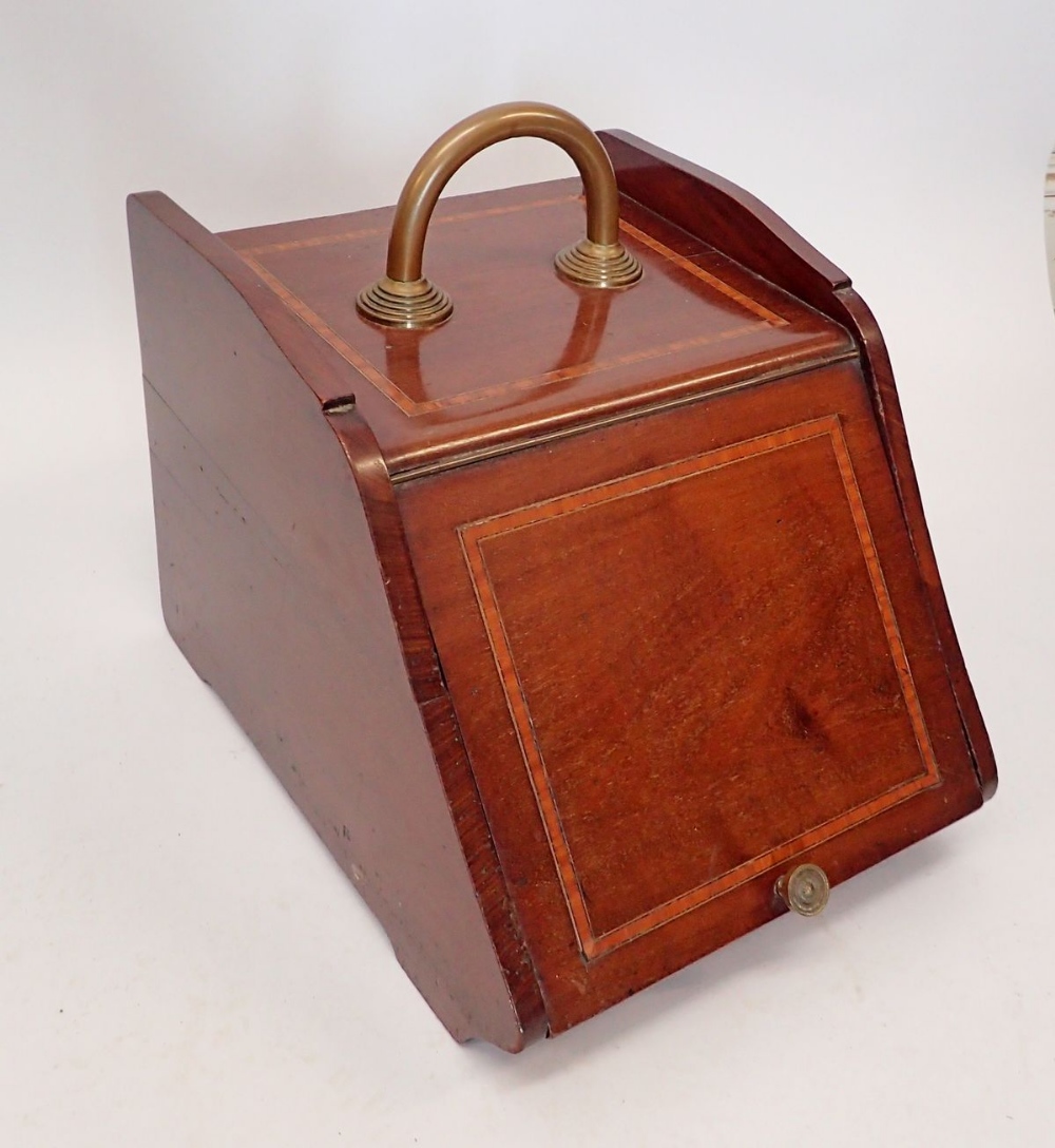 An Edwardian mahogany coal scuttle