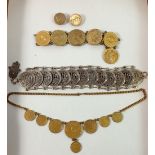 A French coin necklace and earrings and two coin bracelets