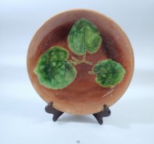 A Majolica plate decorated three leaves, Secla Portugal, 33cm diameter