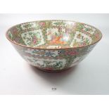 A Chinese 19th century large Canton fruit bowl painted panels of flowers and interior scenes, 37.5cm