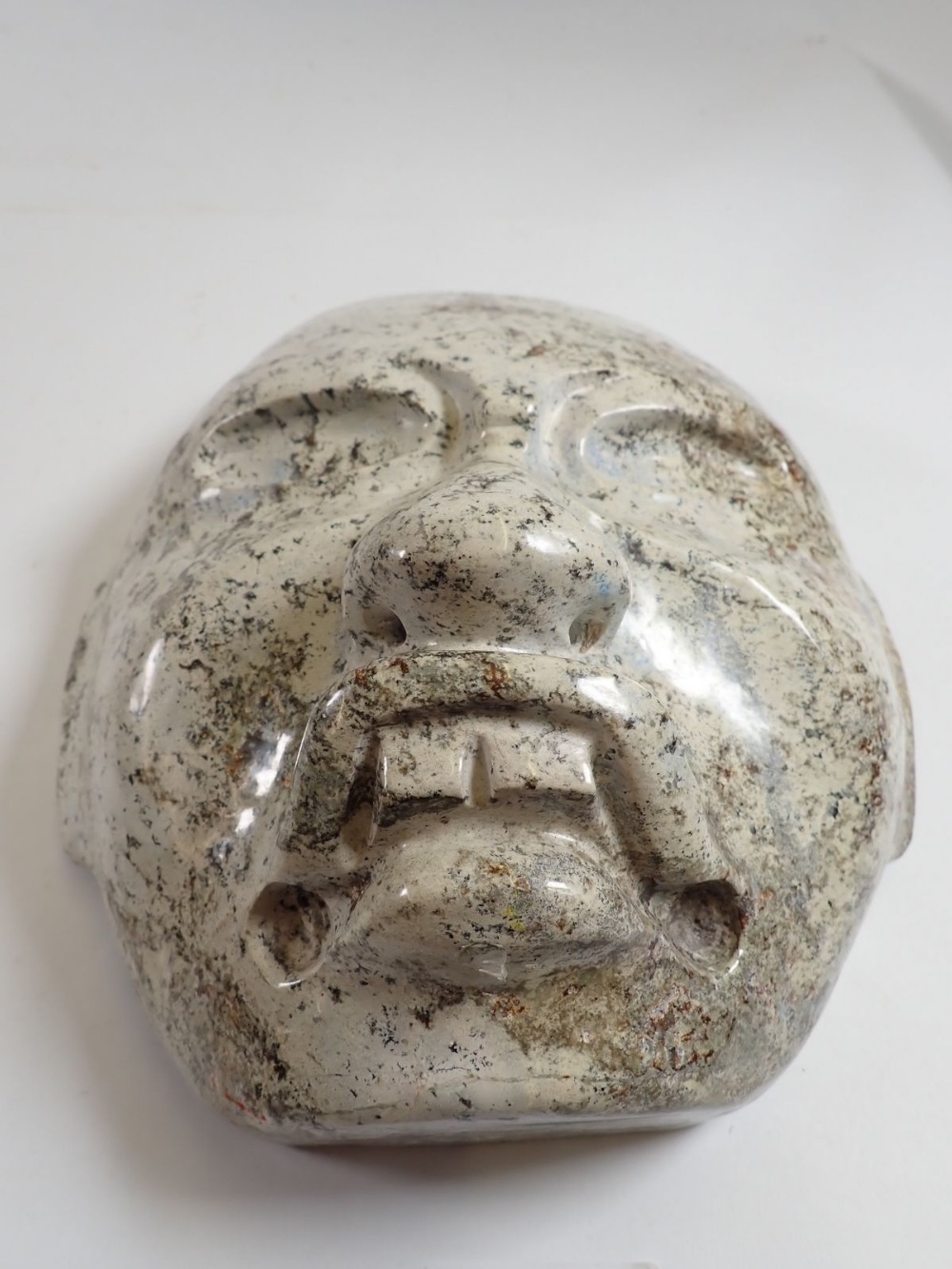 A pale stone carving of a face mask in Olmec style, 23 x 20cm - Image 2 of 3
