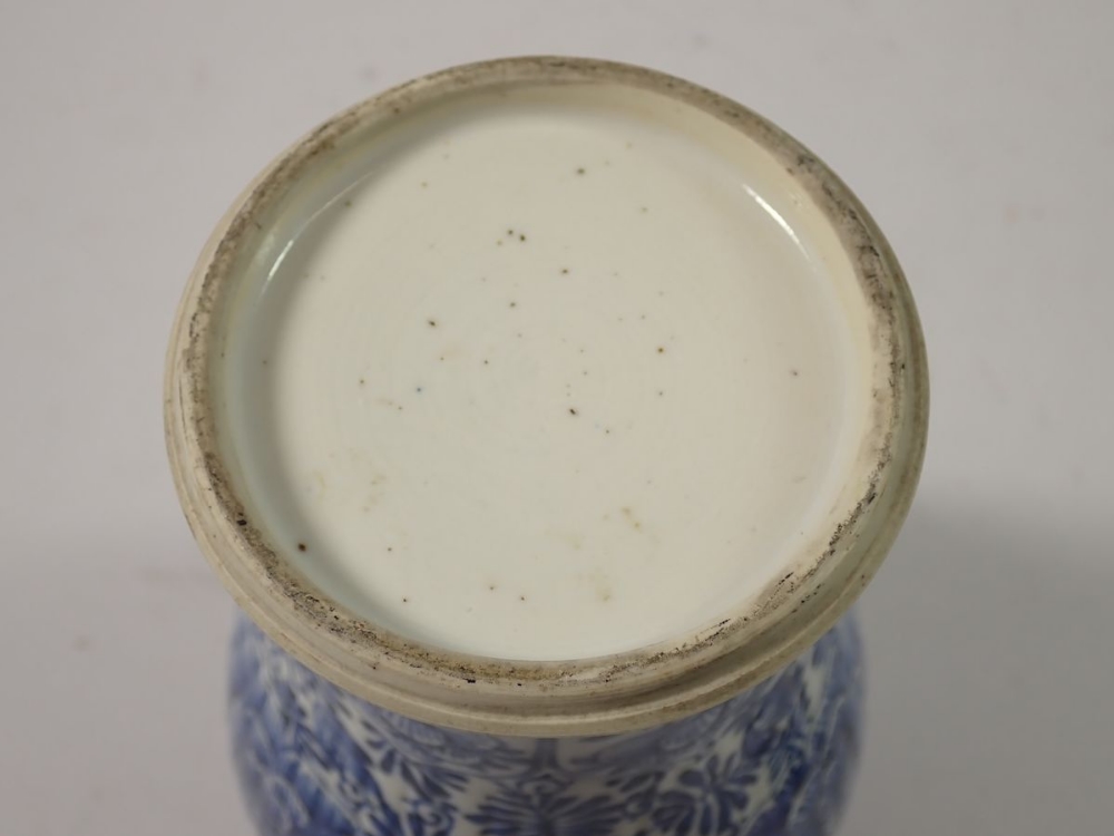 A Chinese 18th century blue and white baluster vase and cover with all over floral decoration, 28cm - Image 7 of 7