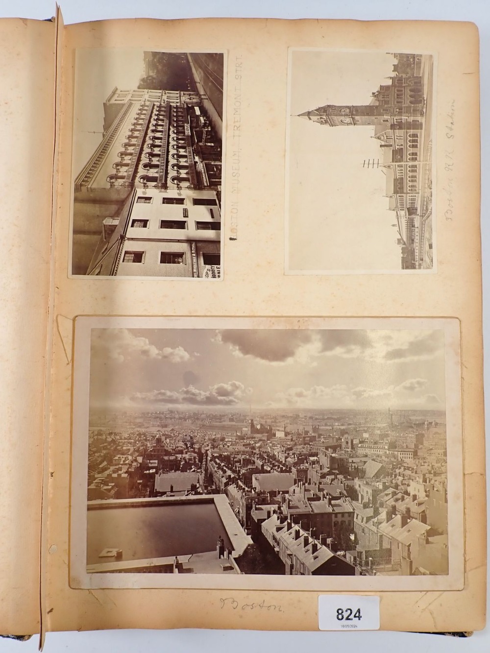A late 19th century album of American photographs, mainly city scenes plus some track and train
