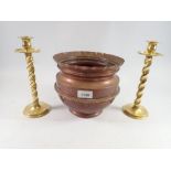 A pair of brass wrythen twist candlesticks, 25cm and copper jardiniere