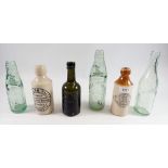 A group of stoneware and glass bottles including William Hall, Family Grocer, Monmouth and W