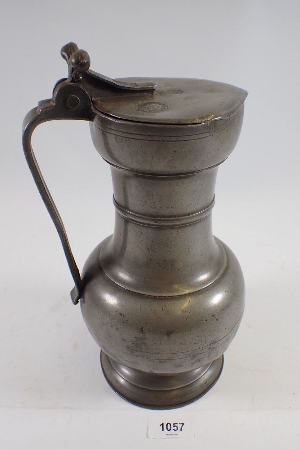 A large 18th century pewter flagon dated 1758 with touchmarks, 30cm tall