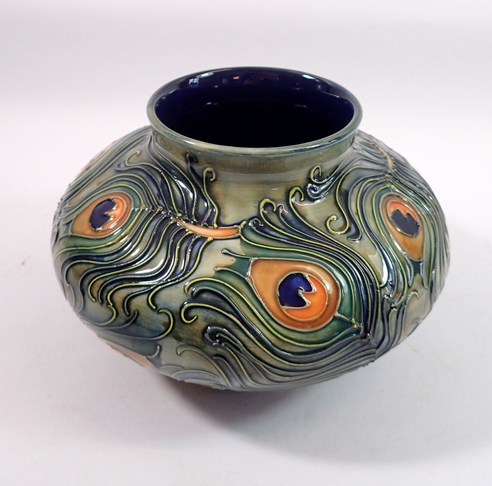 A Moorcroft squat Phoenix pattern vase decorated peacock feathers, 12cm tall