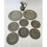 Two early 19th century pewter platters, six plates and an Ashberry & Son ewer