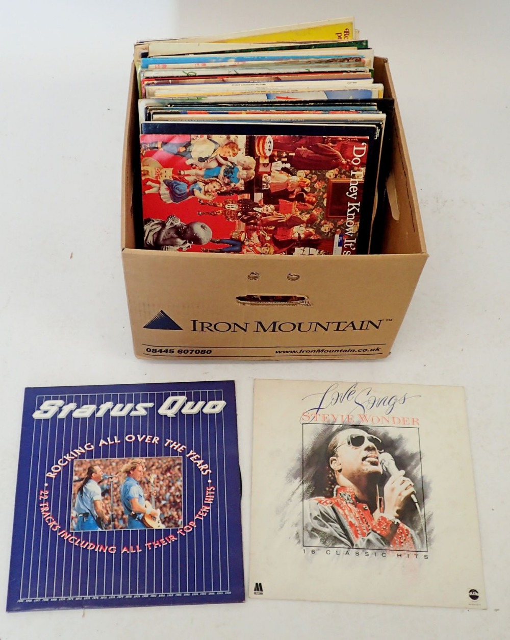 A box of pop and rock records including Barbara Streisand, Status Quo, Tina Turner etc.