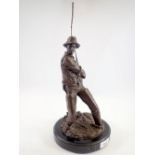 A bronze finish figure of a fisherman after Milo on marble base, 41cm tall