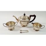 A silver tea service with leaf and berry border, Birmingham 1933 by James Walter Tiptaft and a