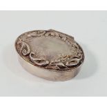 A modern silver oval pill box with embossed scrollwork decoration, 9g, 3 x 2.3cm