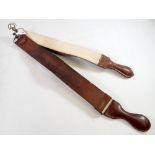 Two leather cut throat razor strops