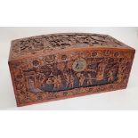 A Chinese camphorwood chest with dome top, carved oriental scenes, 90cm wide