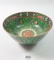 A Chinese Canton bowl painted leaves and butterflies