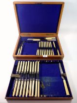 A part set of cutlery in fitted oak case