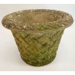 A reconstituted stone garden urn with basket weave decoration 33cm tall