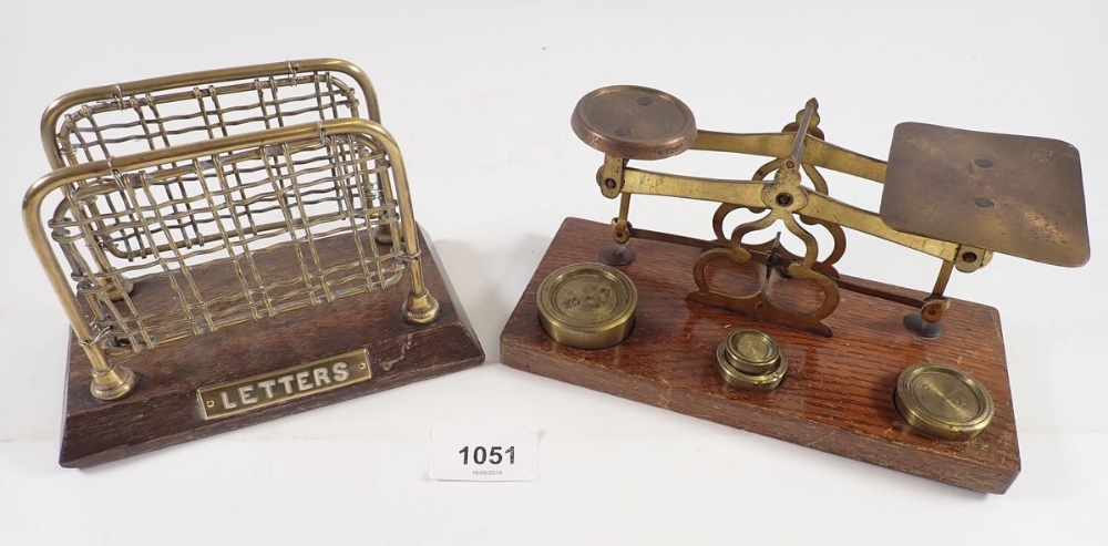 A set of postal scales and a brass letter rack