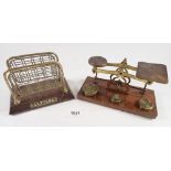 A set of postal scales and a brass letter rack