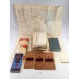 A box of old maps including Bartholomews Tourists Cycle maps, OS maps on linen including military