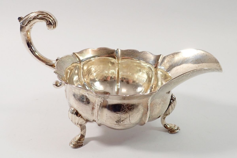 A George II silver sauce boat, London 1749 by John Pollock, 388g